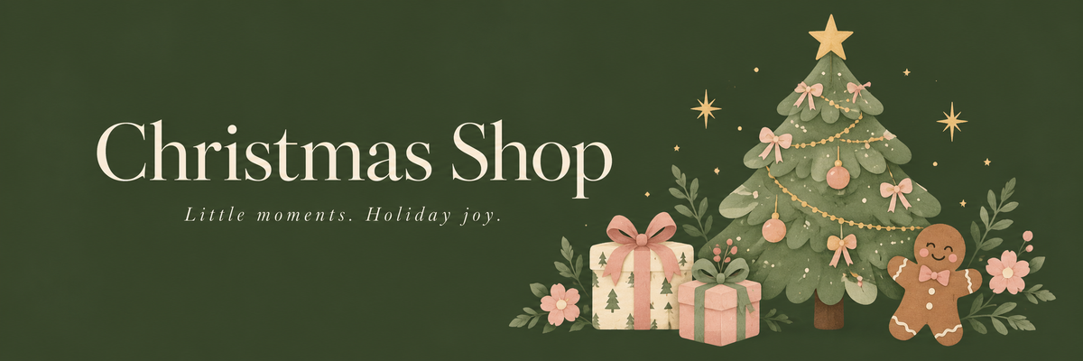 Christmas Shop — Little moments. Holiday joy. A Christmas tree, blush gifts, and a smiling gingerbread cookie.