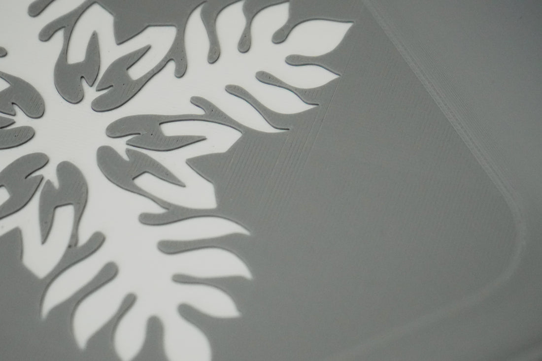 Close-up of the Munching Mahu logo detail on a pale blue tray