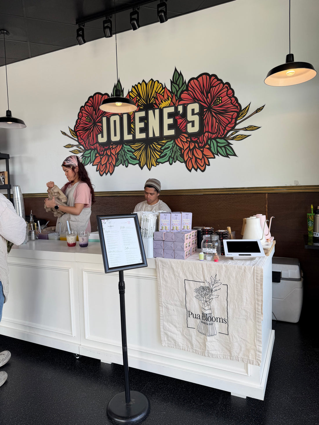 Pua Blooms pop-up counter at Jolene's with Formi matcha clickers on display